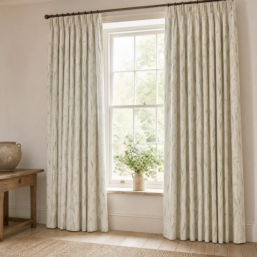 Snowbell Ivory linen curtains with a delicate green snowdrop print in a light country room