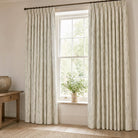 Snowbell Ivory linen curtains with a delicate green snowdrop print in a light country room