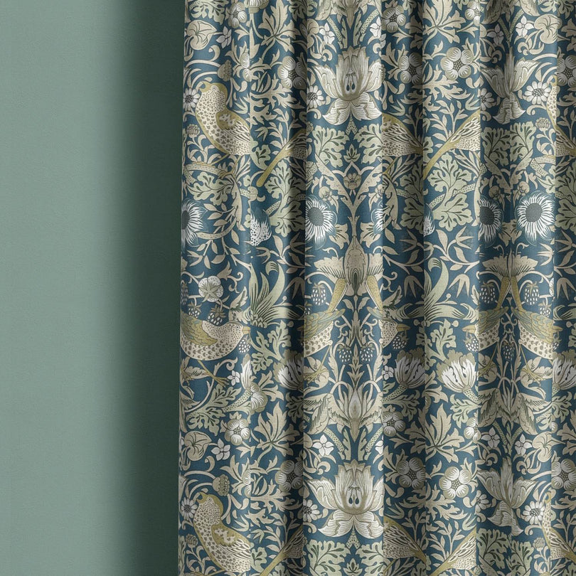 Songbird Upholstery Fabric in regal navy blue, perfect for a statement piece