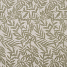 Flat swatch of Stratford Sage leaf design upholstery fabric in muted green tone