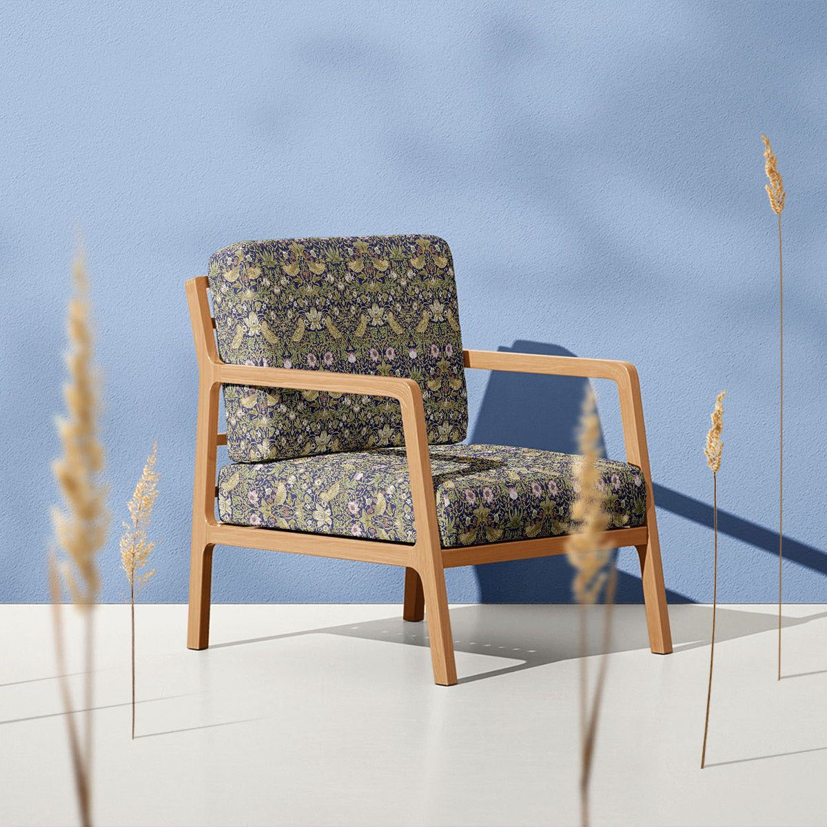 Blue Strawberry Thief Crib 5 velvet upholstery fabric on a traditional statement armchair