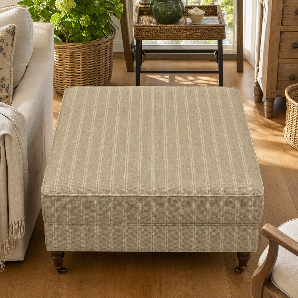 Suffolk Straw striped upholstery fabric shown on a stool, soft neutral stripe fabric for upholstered seating and cushions