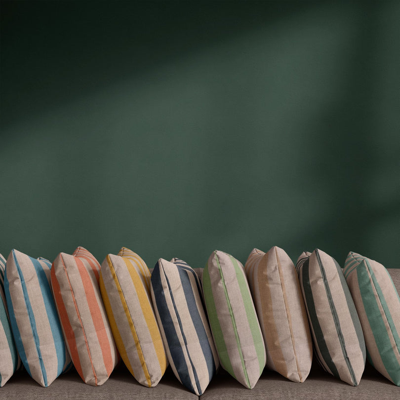 Tirso striped linen curtain fabric shown in 11 colourways with painterly stripe design