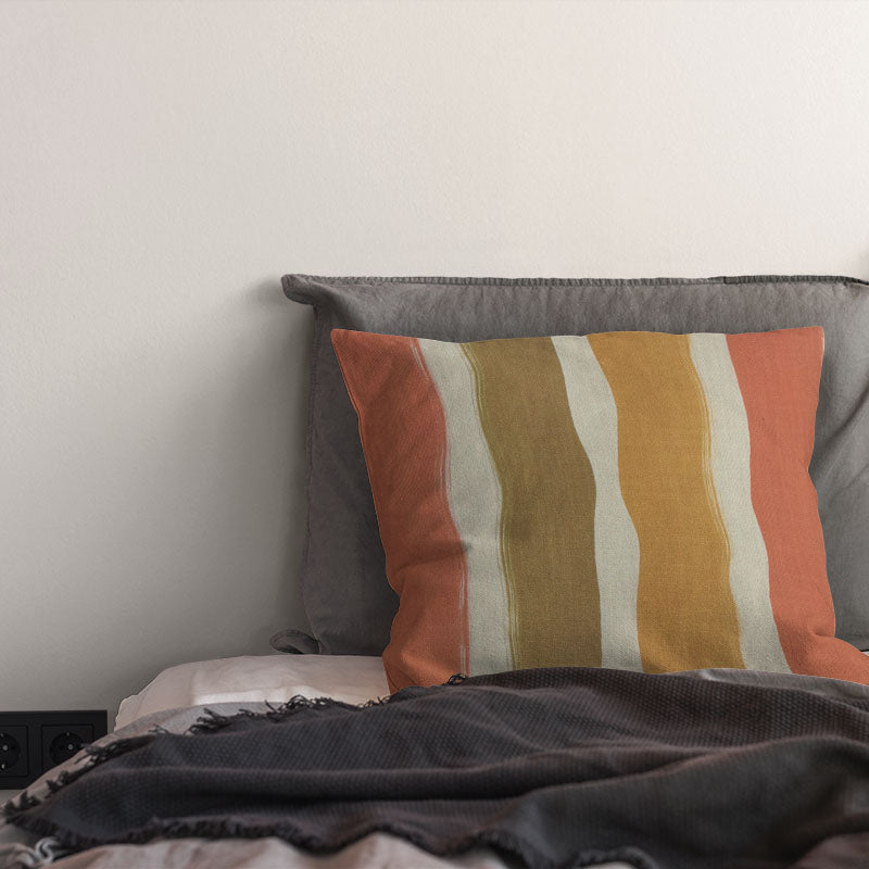 striped curtain fabric cushion in warm ochre and golden tones with painterly stripe design on linen curtain fabric