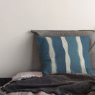 striped curtain fabric cushion in deep marine teal tones with soft vertical stripe pattern on linen blend curtain fabric