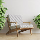 Vesper Black geometric velvet upholstery fabric on chair