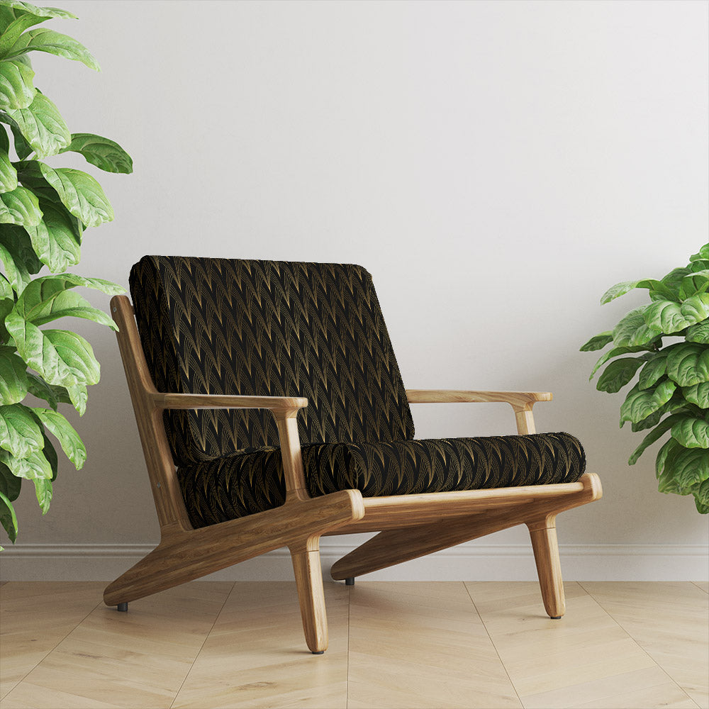 Vesper Ebony Gold printed velvet upholstery fabric on chair