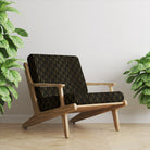 Vesper Ebony Gold printed velvet upholstery fabric on chair