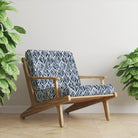 Upholstered chair in Watercolour Foliage Velvet Fabric in Indigo – moody velvet leaf design styled on wood armchair