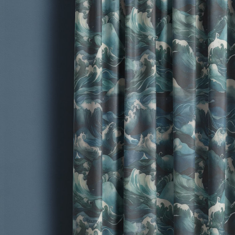 Waves Ink curtain fabric hanging in soft folds showing deep blue and teal wave pattern