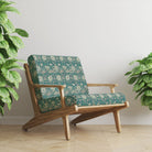 Woodford Teal velvet upholstery fabric on armchair in rich teal with cream Arts and Crafts floral print