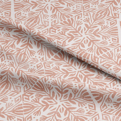 Close-up of Baran Linen Curtain Fabric in Terracotta with natural light filtering through