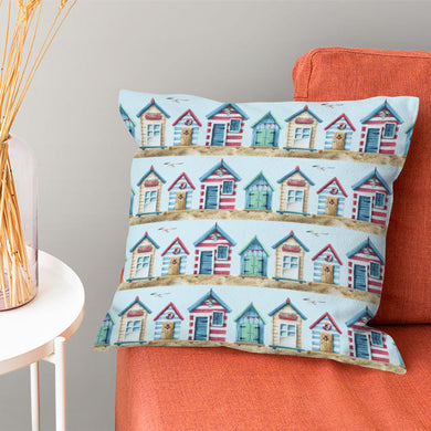 Blue cotton curtain fabric with a delightful beach hut design, perfect for a coastal or nautical-themed interior