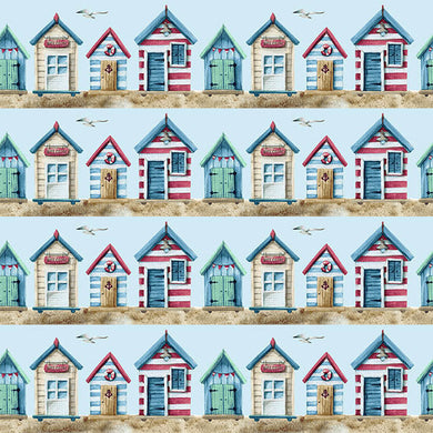 Beach Huts Cotton Curtain Fabric in Blue, featuring charming seaside huts and boats
