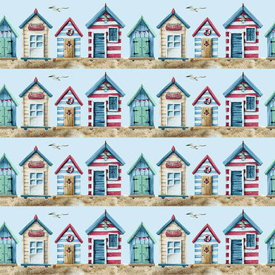 Beach Huts Cotton Curtain Fabric in Blue, featuring charming seaside huts and boats