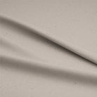 Soft and breathable calico cotton fabric in natural cream color