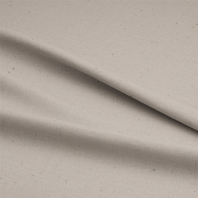 Soft and breathable calico cotton fabric in natural cream color