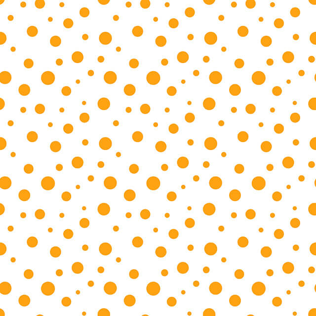 Confetti Cotton Curtain Fabric - Satsuma in vibrant orange and yellow hues