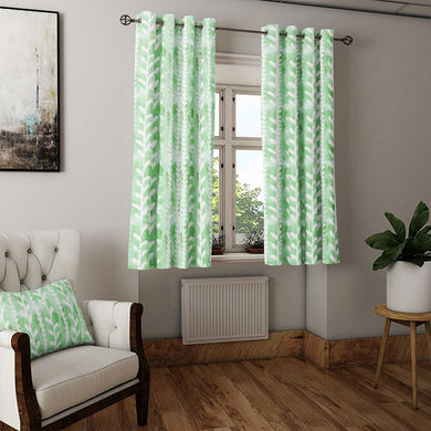 Delilah Cotton Curtain Fabric in Green, creating a refreshing and serene ambiance in a living space
