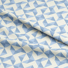  Close up of the Geometry Cotton Curtain Fabric - Sky, showcasing the intricate details of the geometric pattern and the soft texture of the fabric 
