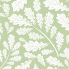 Close up of Oak Leaf Cotton Curtain Fabric in Sage Green, showing intricate leaf pattern and soft texture