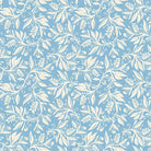A flat lay of Oxford Wedgewood linen blend fabric featuring a detailed white leaf and berry print on a soft wedgewood blue background.