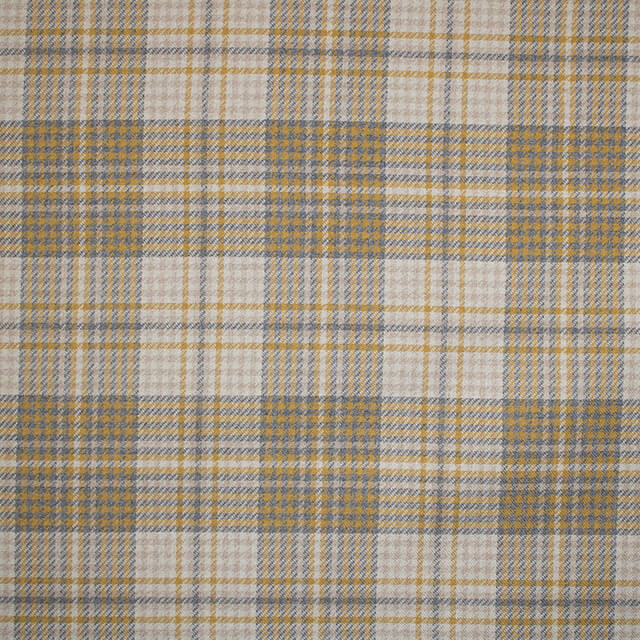 Close up of Sandringham Plaid Upholstery Fabric in Ochre, a rich and luxurious golden yellow color, with a classic and timeless plaid pattern, perfect for adding warmth and elegance to any interior design project